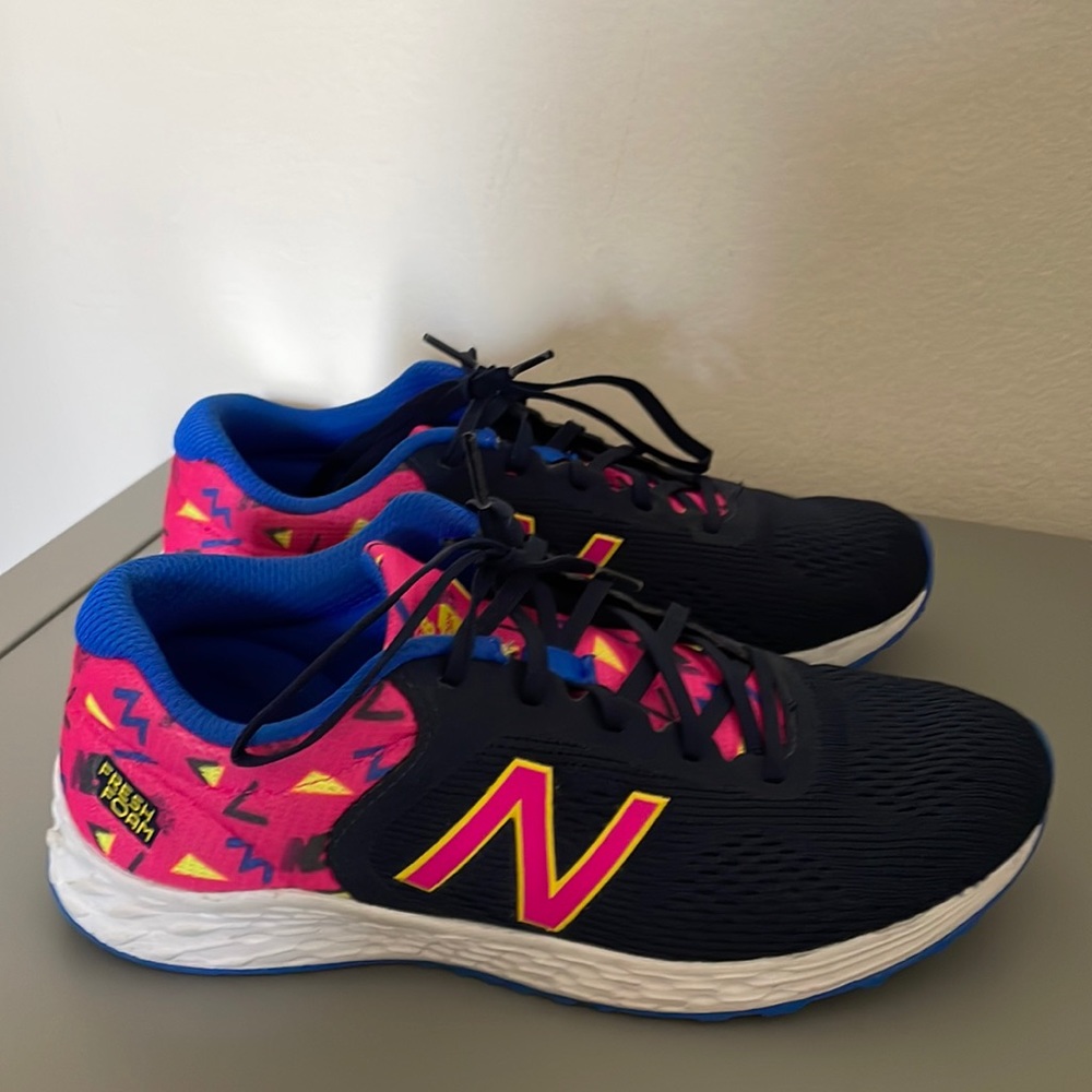 New balance kids’ sneakers in bright pink/black/blu. Excellent condition.